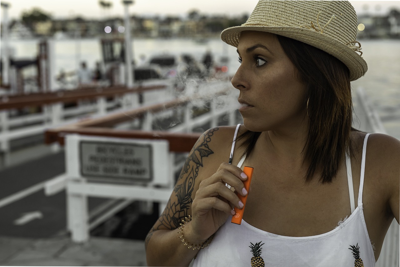 Woman Using Disposable Vape